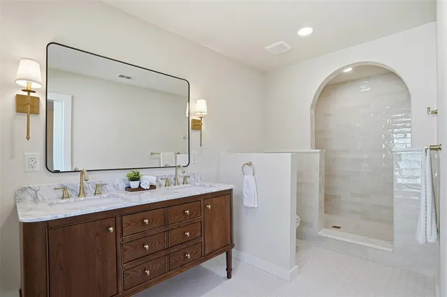 a view of a bathroom with a glass shower door
