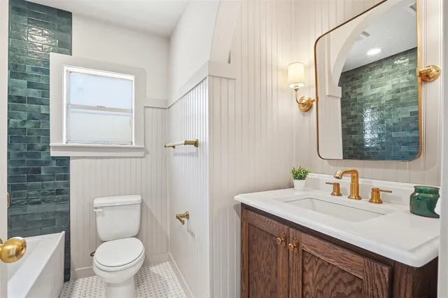 a bathroom with a toilet and a bathtub