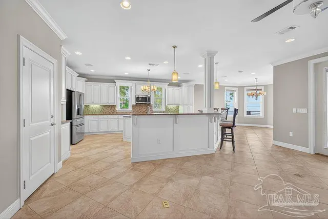 a kitchen with stainless steel appliances granite countertop a sink and stove