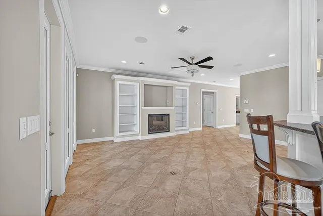 a view of an empty room and wooden floor