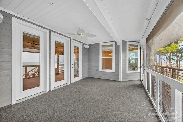 a bathroom with a granite countertop double vanity sink a mirror and