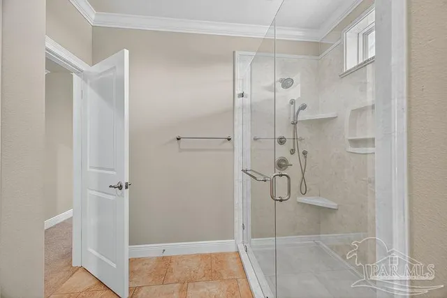 a bathroom with a granite countertop toilet a sink and shower
