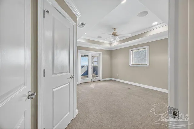 a view of an empty room with a window