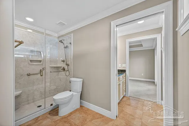 a view of a hallway with wooden floor and chandelier