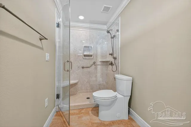 a view of empty room with wooden floor and cabinet
