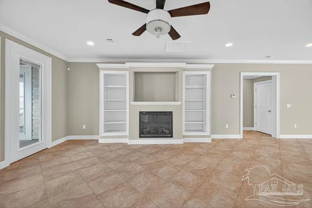 a large white kitchen with cabinets a sink and appliances