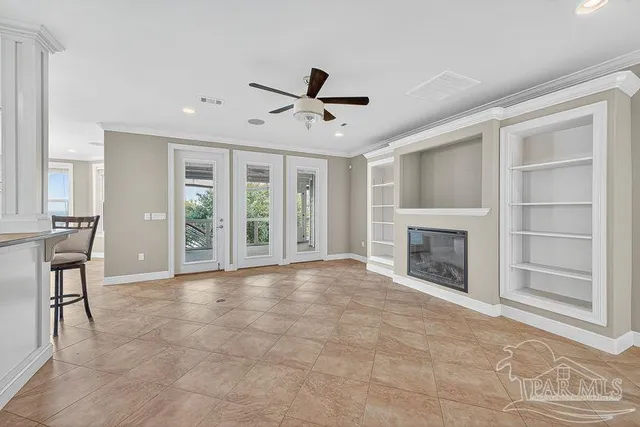 a large white kitchen with kitchen island a stove a sink dishwasher and white cabinets with wooden floor