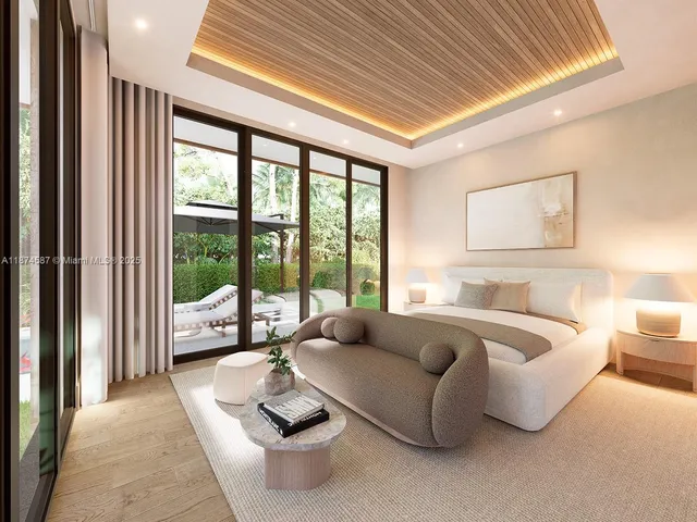 a spacious bedroom with furniture and a large window