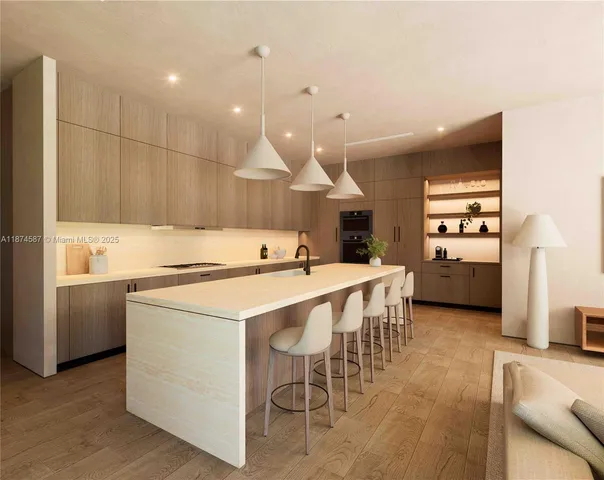 a kitchen with a sink a counter top space stainless steel appliances and cabinets