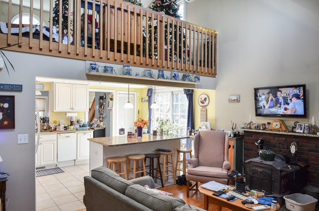 60 Marlboro Road Berlin, MA 01503 - Photo 15 of 34 a living room with furniture and a flat screen tv