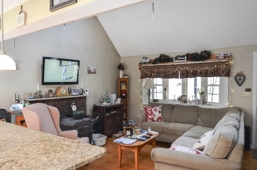 60 Marlboro Road Berlin, MA 01503 - Photo 19 of 34 a living room with furniture and a fireplace