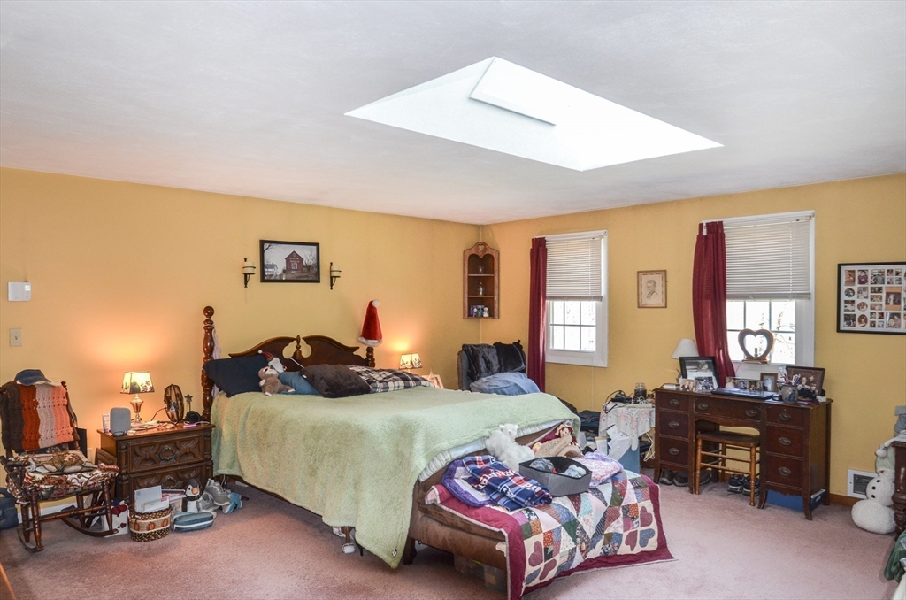 60 Marlboro Road Berlin, MA 01503 - Photo 24 of 34 a bedroom with a bed and dresser with chair