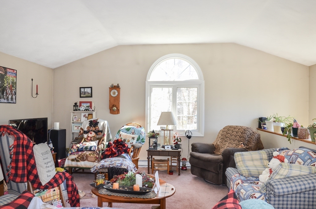 60 Marlboro Road Berlin, MA 01503 - Photo 28 of 34 a living room with furniture and a floor to ceiling window