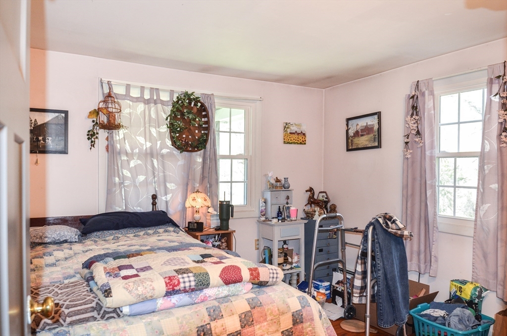 60 Marlboro Road Berlin, MA 01503 - Photo 30 of 34 a bedroom that has a bed and a table in it