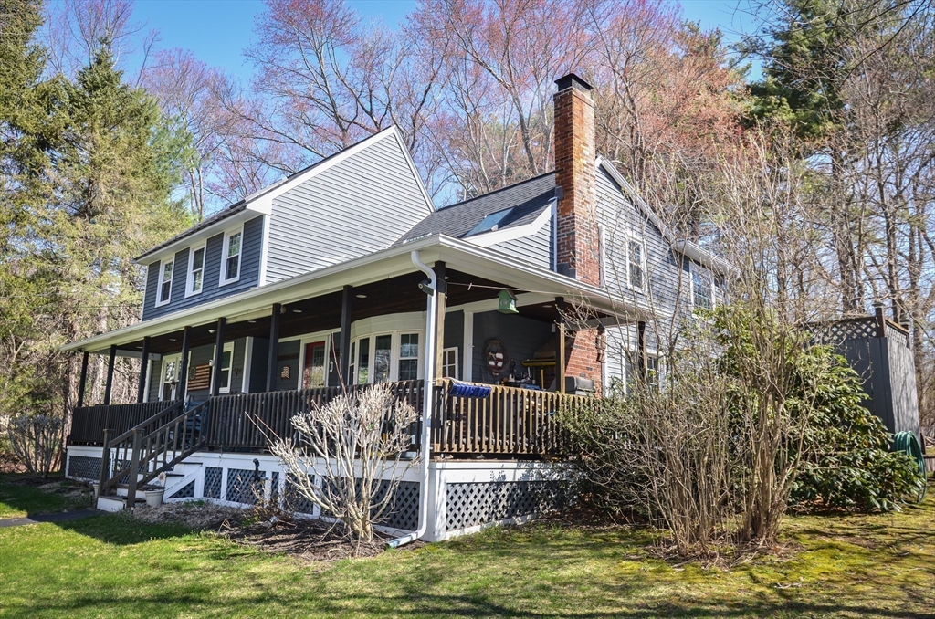 60 Marlboro Road Berlin, MA 01503 - Photo 3 of 34 a front view of a house with balcony and garden