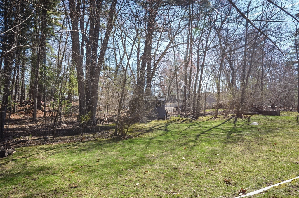 60 Marlboro Road Berlin, MA 01503 - Photo 9 of 34 a backyard of a house with lots of green space and fountain