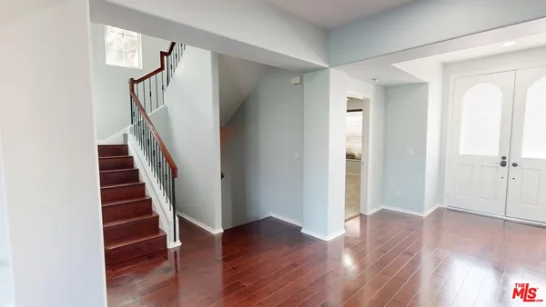 a view of entryway with wooden floor