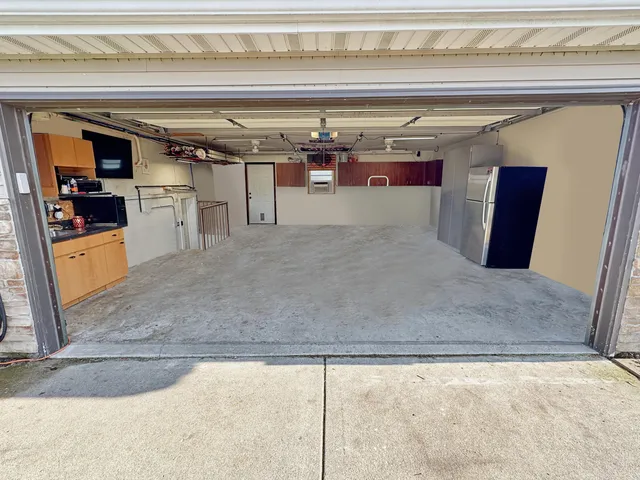 a kitchen with stainless steel appliances granite countertop a sink and cabinets