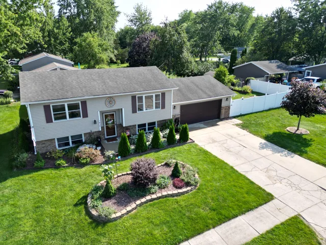 a view of a house with a garden and plants