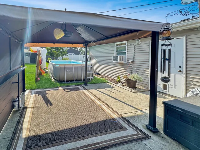 a view of a terrace with wooden fence
