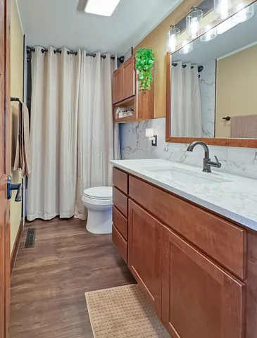 a bathroom with a double vanity sink and a mirror
