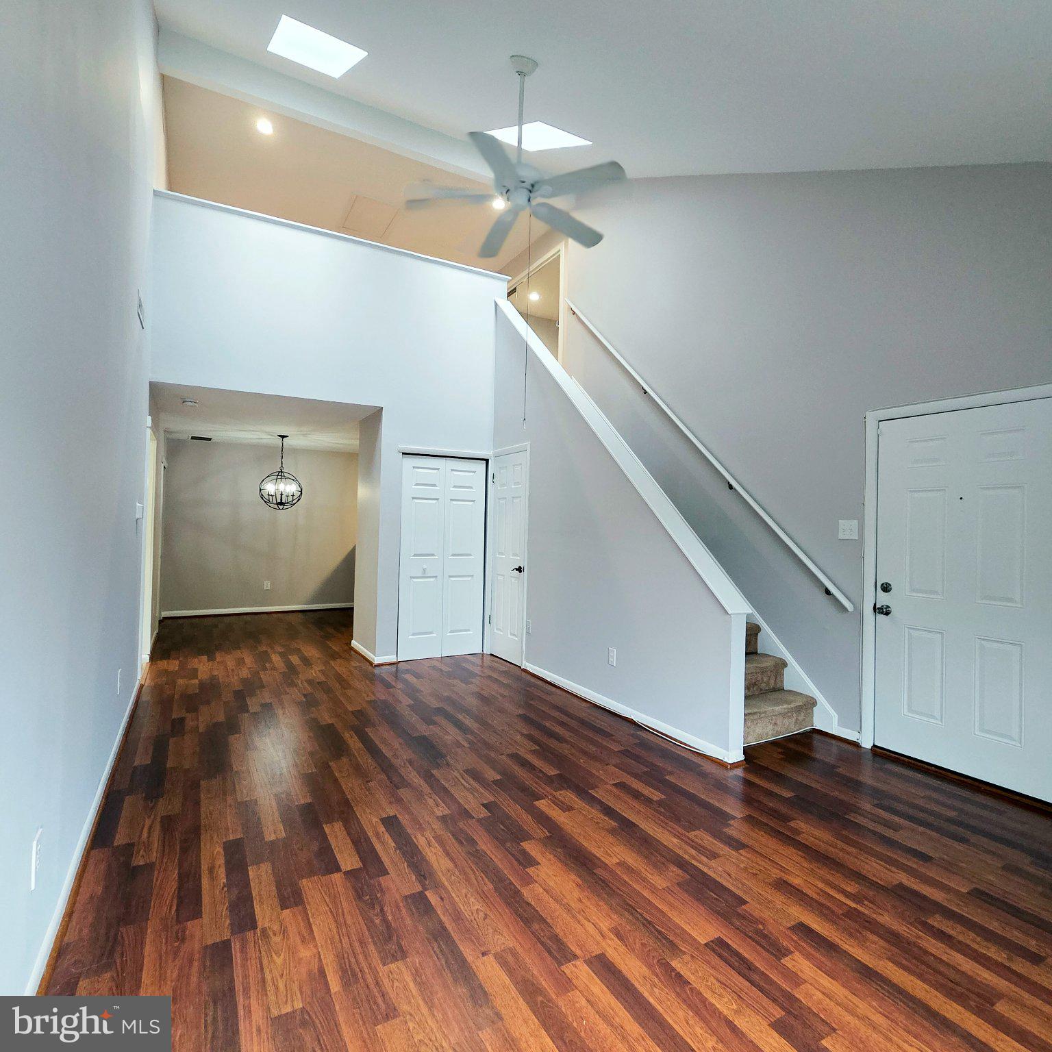 208 Ashley Run Voorhees, NJ 08043 - Photo 8 of 23 a view of a hallway view with wooden floor and staircase