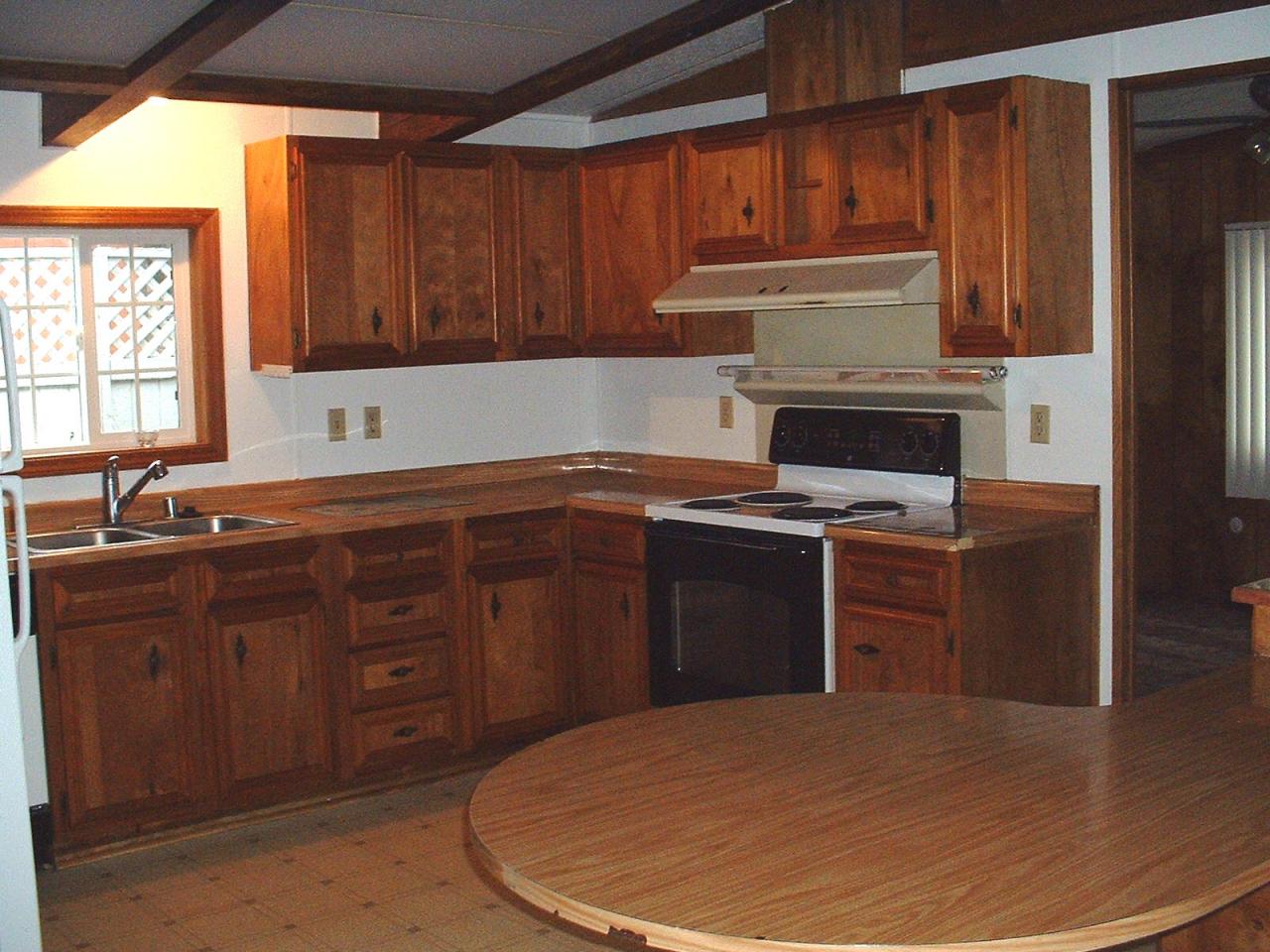 1102 Hillcrest Road Grandview, WA 98930 - Photo 6 of 9 a kitchen with a sink a stove and cabinets