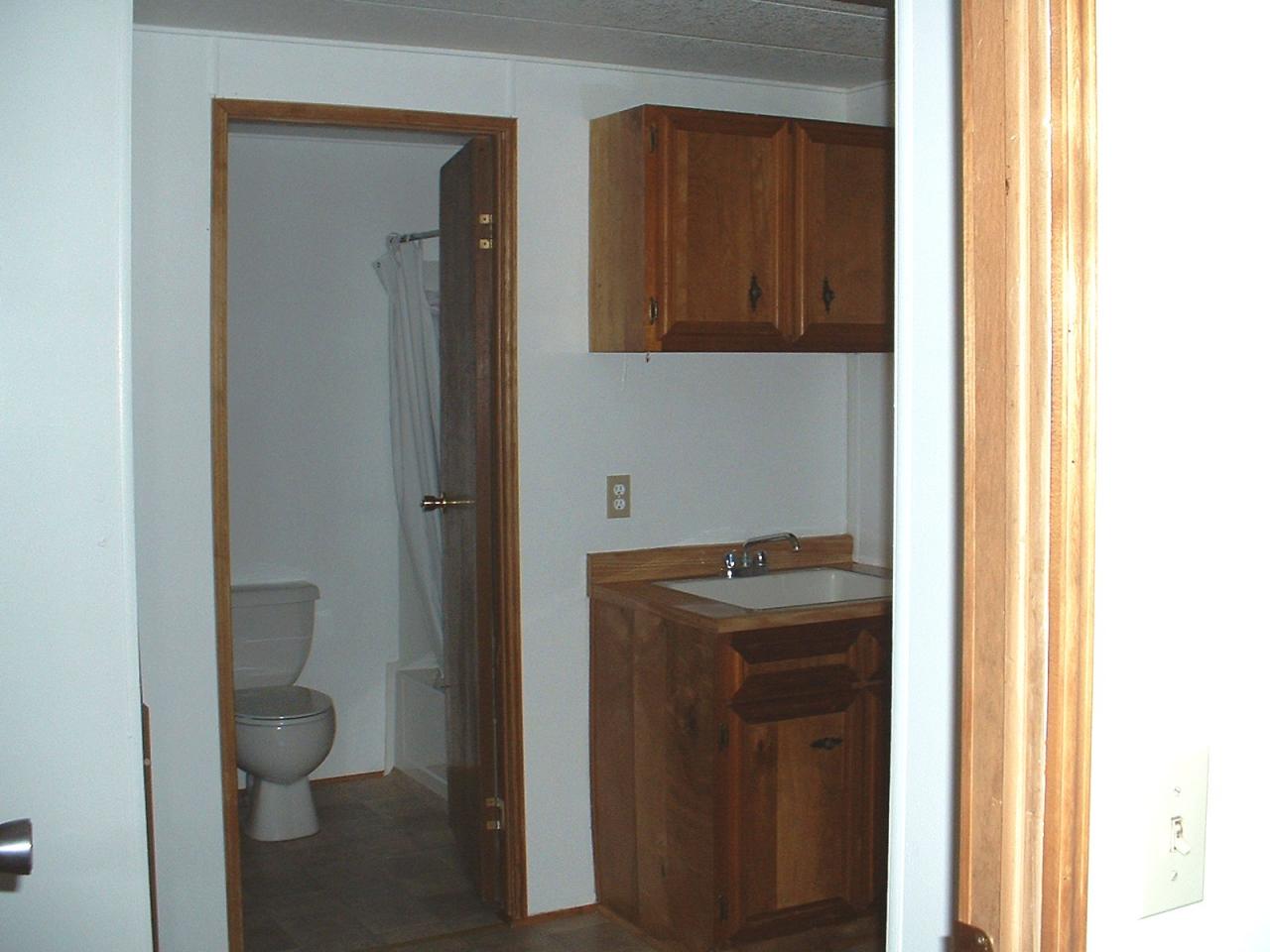 1102 Hillcrest Road Grandview, WA 98930 - Photo 7 of 9 a bathroom with a toilet sink and mirror