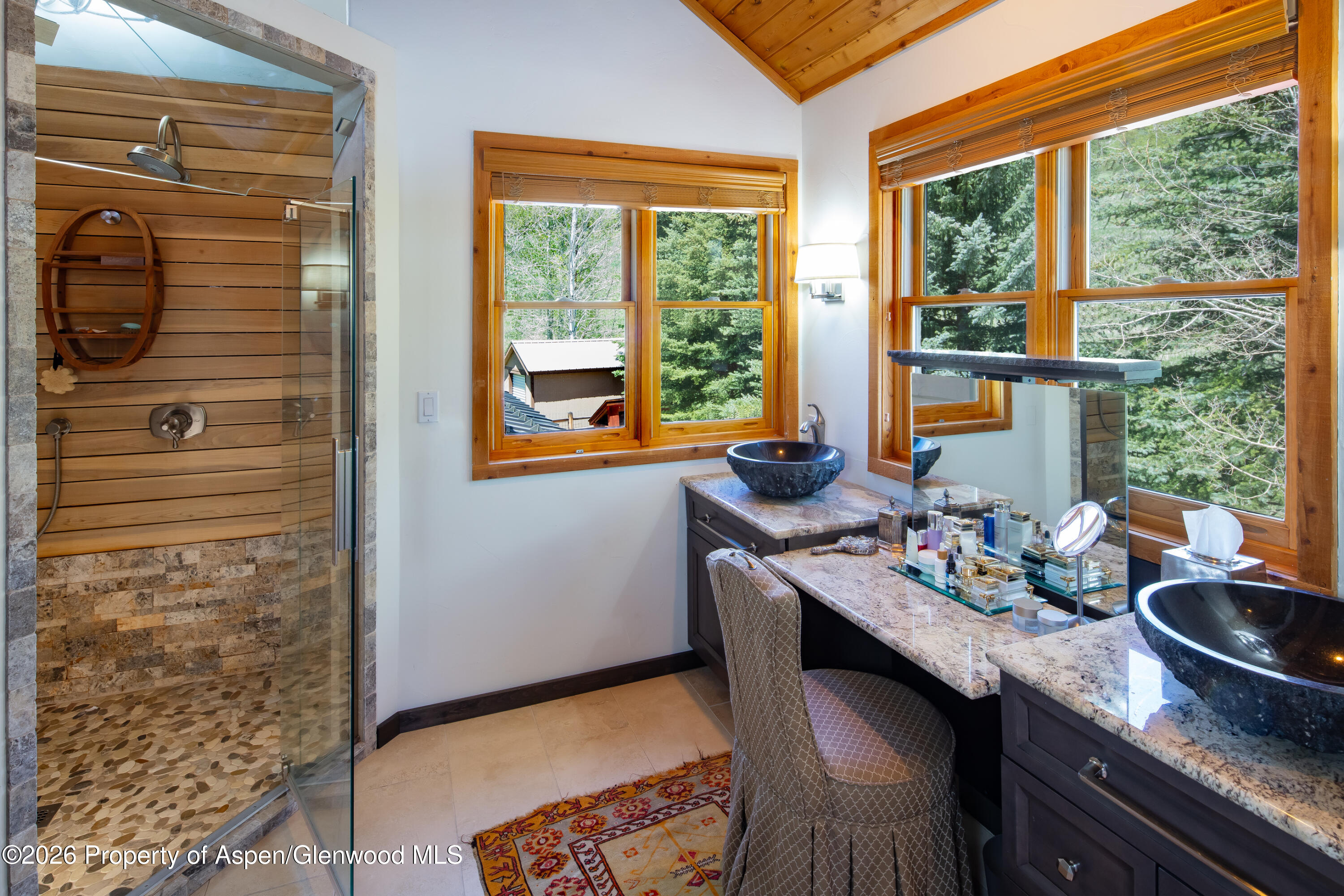 294 Ruedi Creek Road Basalt, CO 81621 - Photo 22 of 27 a room with a table chairs and windows