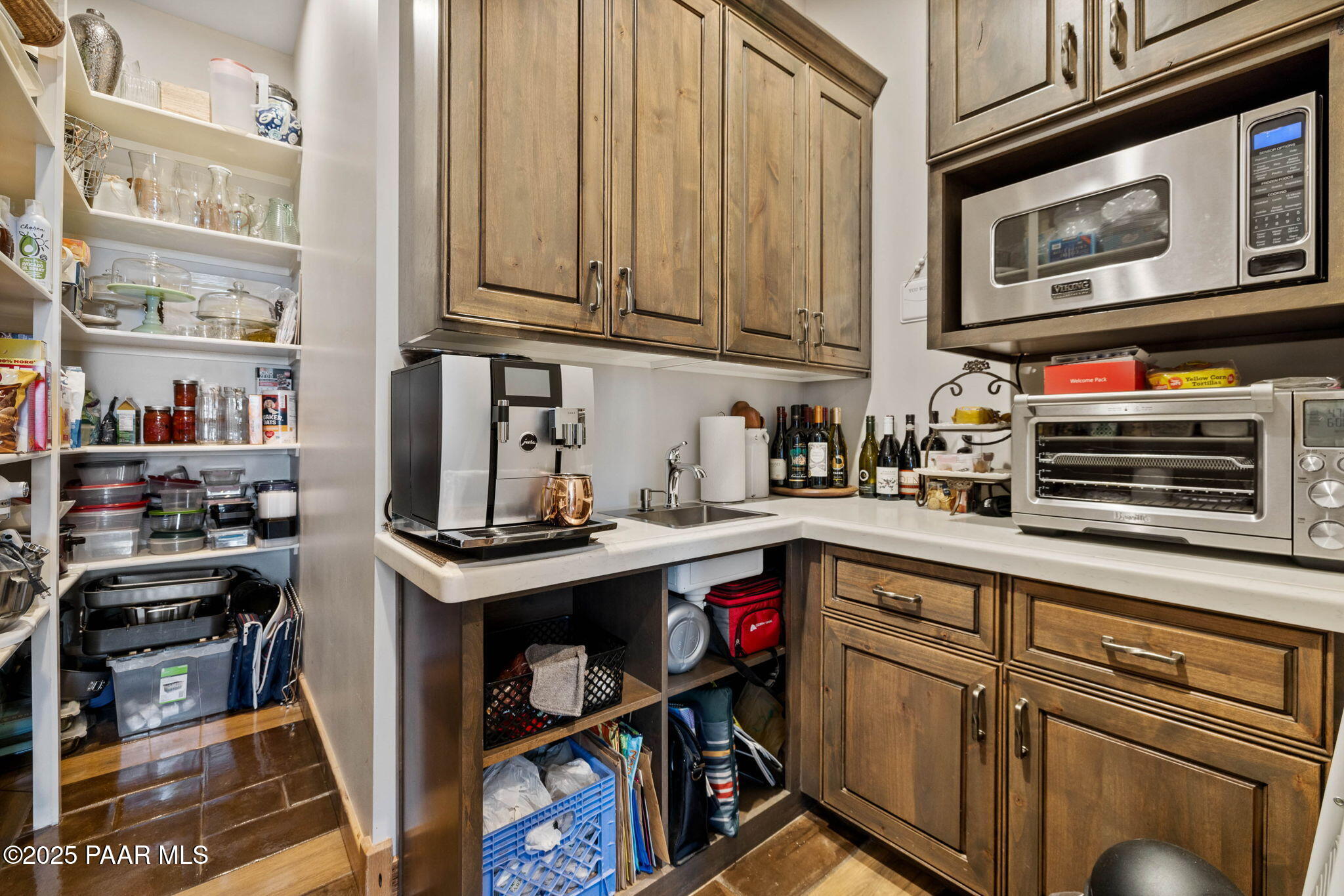 14800 North Puntenney Road Prescott, AZ 86305 - Photo 21 of 100 a kitchen with stainless steel appliances granite countertop a stove and cabinets
