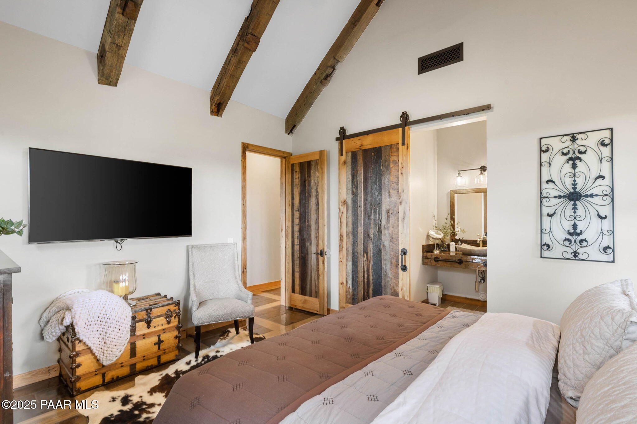 14800 North Puntenney Road Prescott, AZ 86305 - Photo 37 of 100 a bedroom with a bed and a flat screen tv