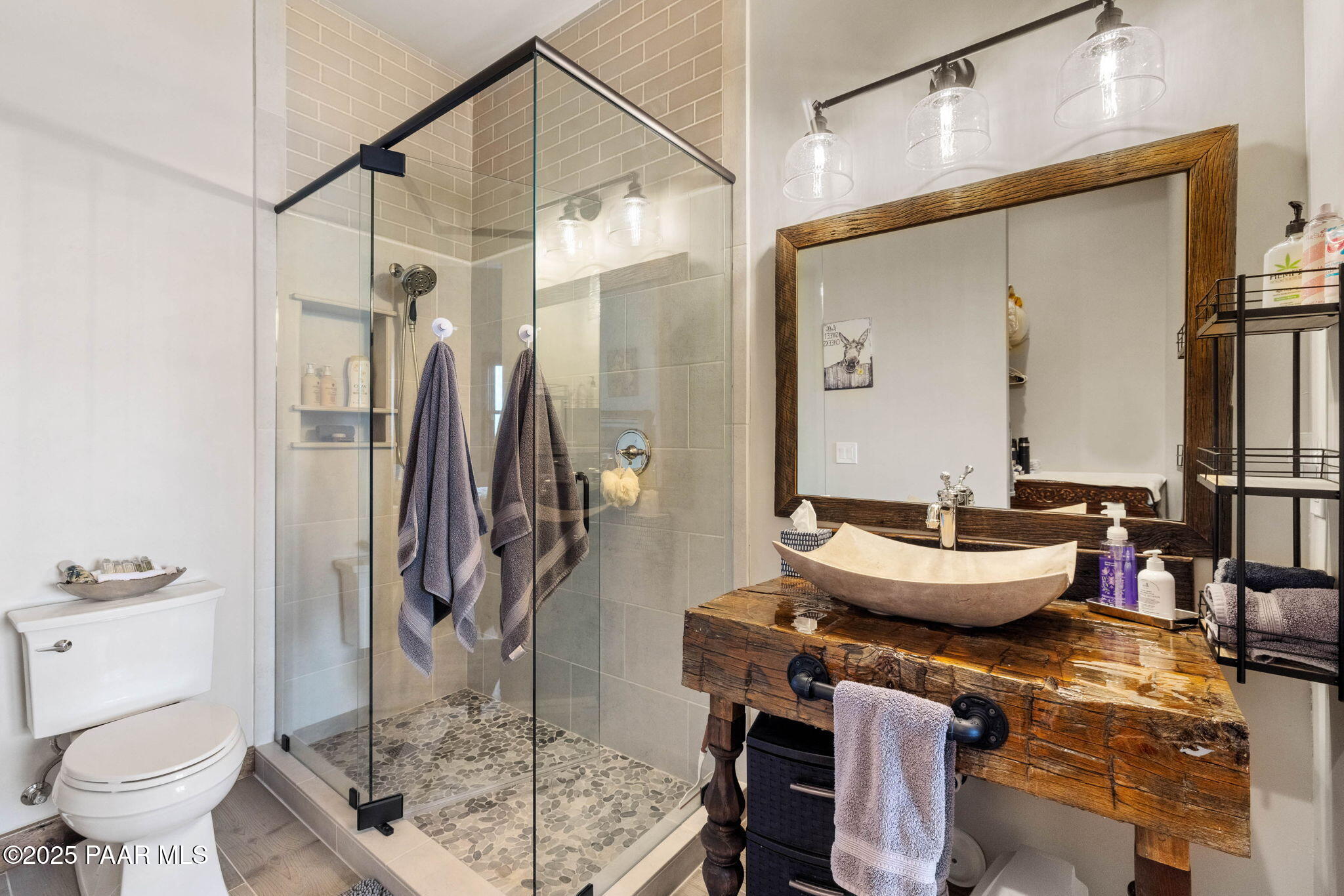 14800 North Puntenney Road Prescott, AZ 86305 - Photo 43 of 100 a bathroom with a granite countertop sink a toilet and a mirror
