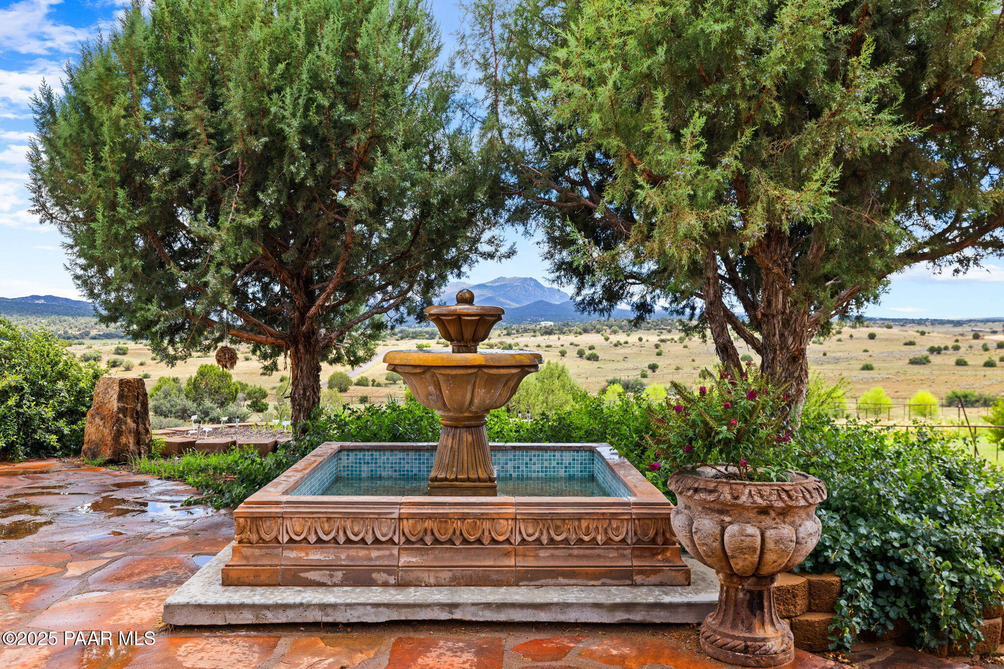 14800 North Puntenney Road Prescott, AZ 86305 - Photo 66 of 100 a view of a fountain in the front of a house