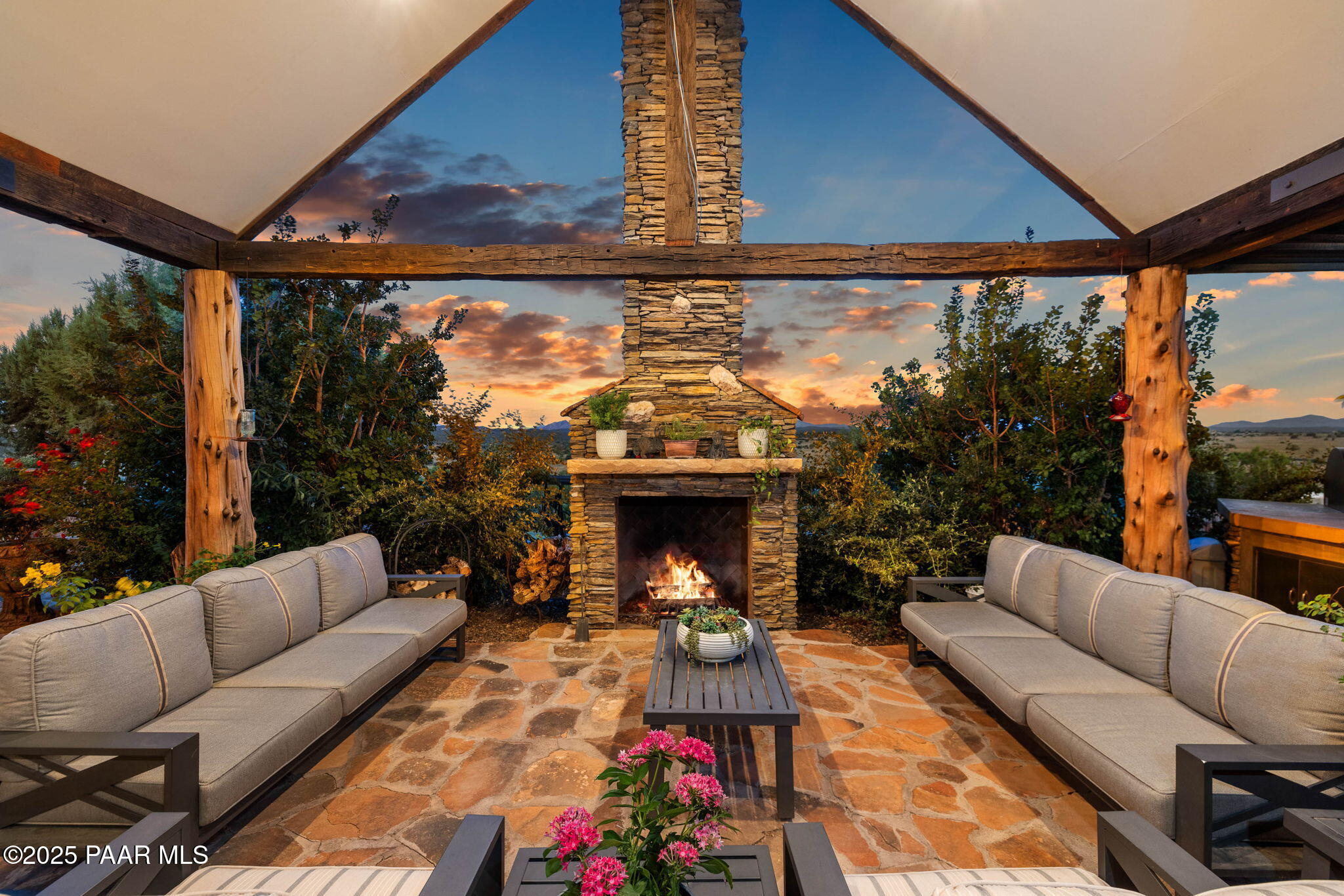 14800 North Puntenney Road Prescott, AZ 86305 - Photo 69 of 100 a living room with furniture a fireplace and a large window