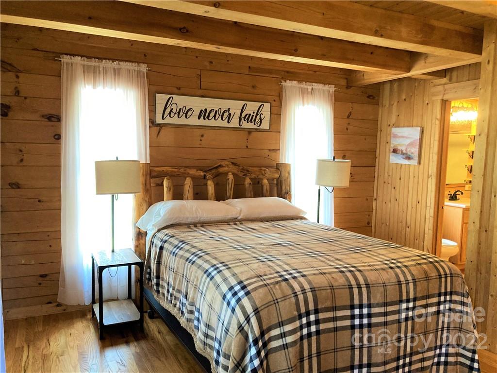 268 Sasafras Ridge Rutherfordton, NC 28139 - Photo 12 of 48 a bedroom with a bed and wooden floor