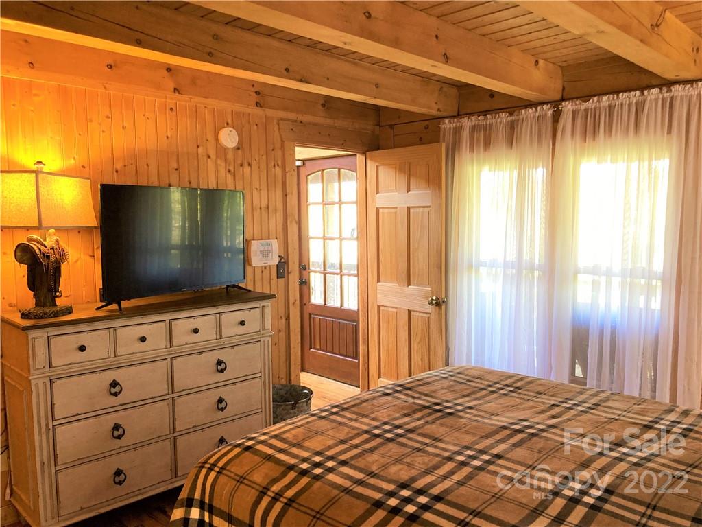 268 Sasafras Ridge Rutherfordton, NC 28139 - Photo 14 of 48 a bedroom with a bed and a flat screen tv