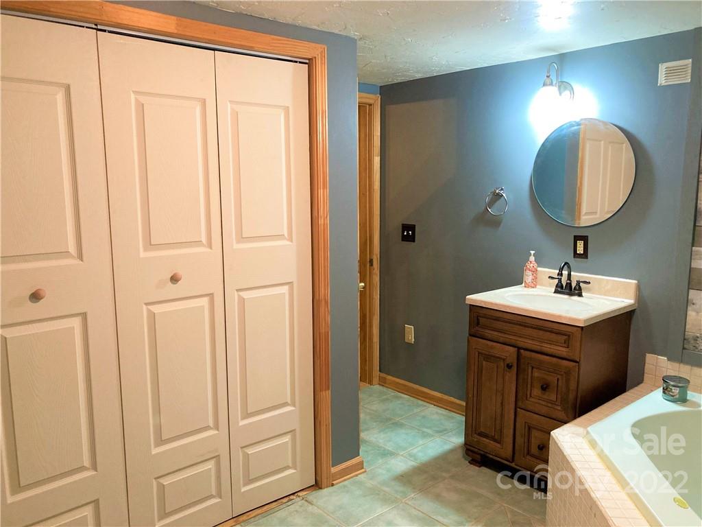 268 Sasafras Ridge Rutherfordton, NC 28139 - Photo 24 of 48 a bathroom with a sink and a mirror