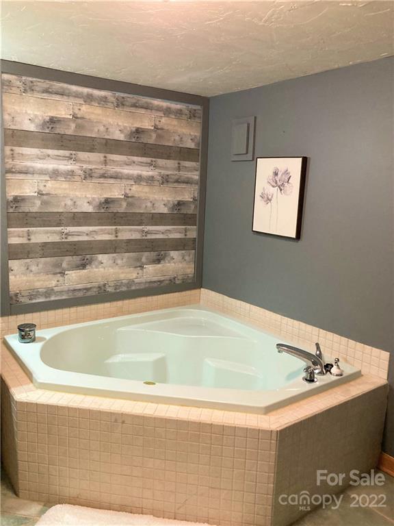268 Sasafras Ridge Rutherfordton, NC 28139 - Photo 25 of 48 a bathroom with a bathtub and shower