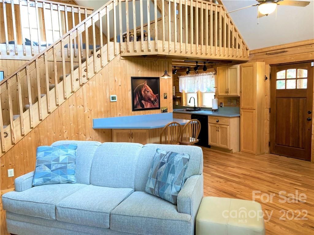 268 Sasafras Ridge Rutherfordton, NC 28139 - Photo 5 of 48 a living room with furniture a fireplace and a chandelier