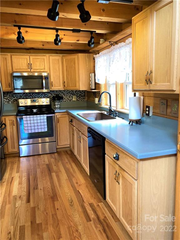 268 Sasafras Ridge Rutherfordton, NC 28139 - Photo 6 of 48 a kitchen with stainless steel appliances granite countertop a sink and a stove