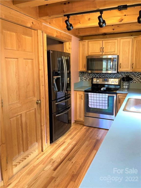 268 Sasafras Ridge Rutherfordton, NC 28139 - Photo 7 of 48 a kitchen with stainless steel appliances granite countertop a refrigerator and a stove top oven