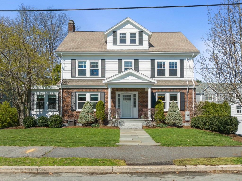 21 Normandy Road Newton, MA 02466 - Photo 1 of 36 a front view of a house with a garden
