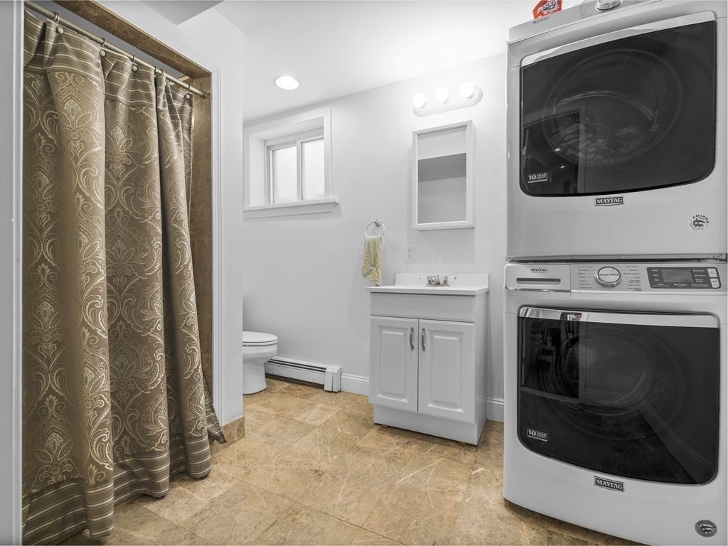 21 Normandy Road Newton, MA 02466 - Photo 27 of 36 a kitchen with a stove and a microwave