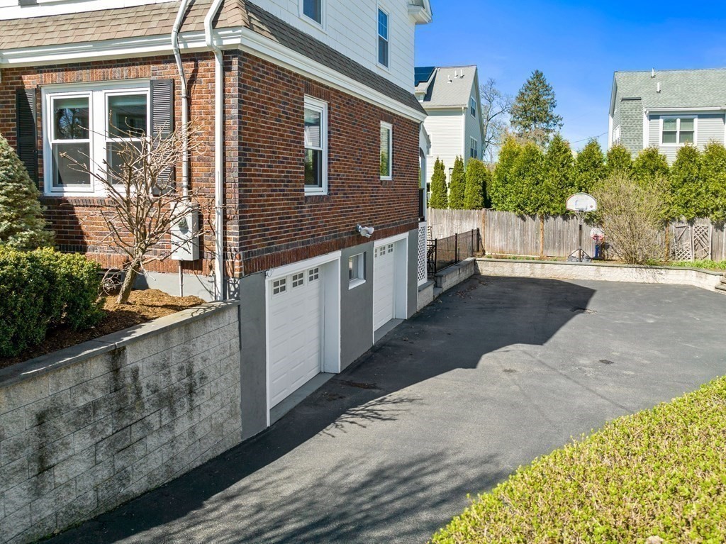 21 Normandy Road Newton, MA 02466 - Photo 31 of 36 a front view of a house with trees