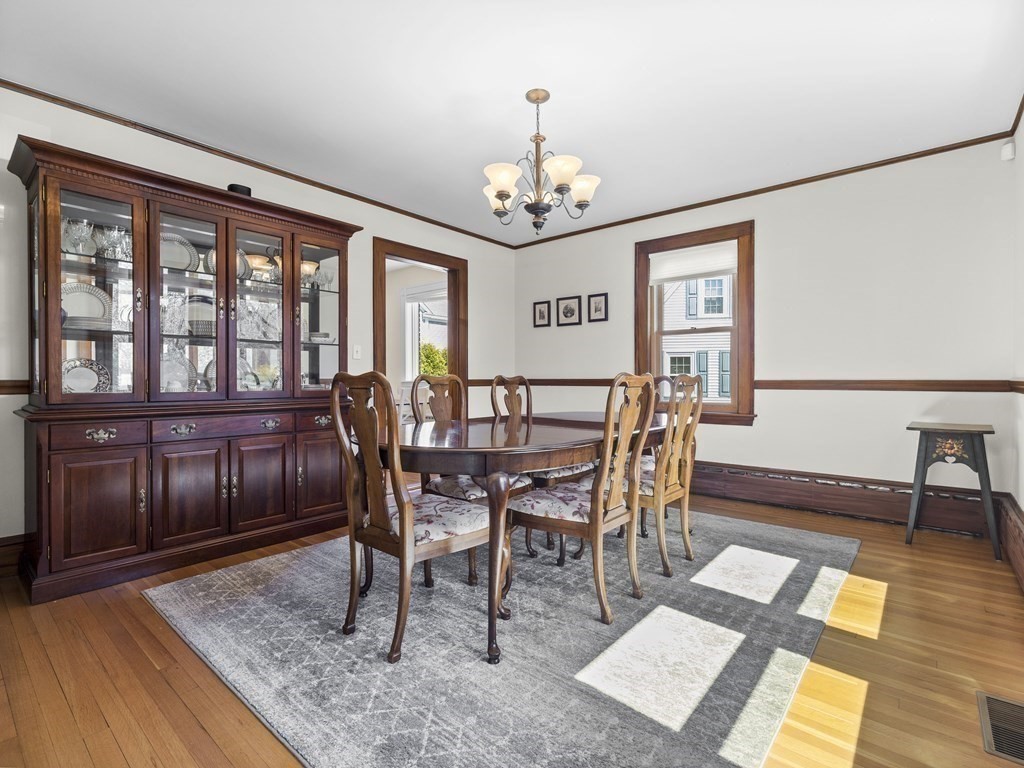 21 Normandy Road Newton, MA 02466 - Photo 5 of 36 a view of a dining room with furniture a chandelier and wooden floor