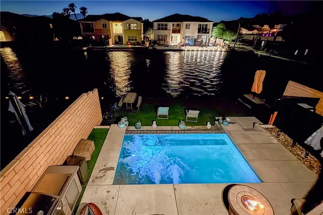 a view of swimming pool with seating space