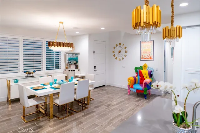 an aerial view of multiple houses with a yard