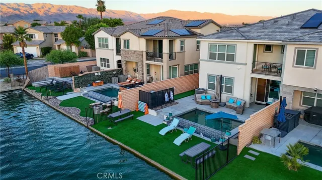 a bathroom with a granite countertop sink mirror and toilet