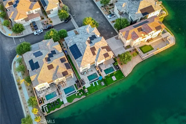 an aerial view of residential house with outdoor space and swimming pool