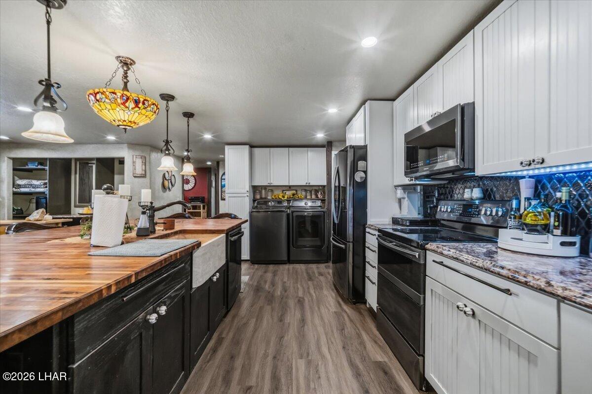 3170 Parker Dam Road, Unit 18 Parker, AZ 85344 - Photo 10 of 88 a large kitchen with stainless steel appliances granite countertop a stove refrigerator and microwave